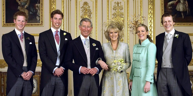 The Prince of Wales and his bride Camilla, Duchess of Cornwall, are flanked by their children Prince Harry, Prince William, Laura Parker Bowles and Tom Parker Bowles in the White Drawing Room at Windsor Castle. The couple tied the knot on April 9, 2005.