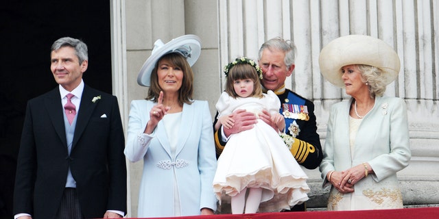 King Charles holds Camilla's granddaughter adjacent to Kate Middleton's parents Michael and Carole Middleton, conscionable aft nan wedding of Prince William and Kate Middleton.