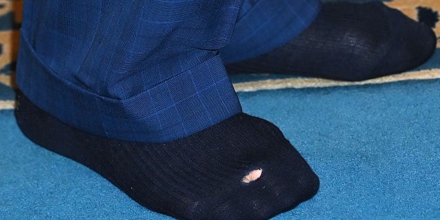 The socks of Britain's King Charles III are pictured during his visit to Brick Lane Mosque in east London Feb. 8, 2023.