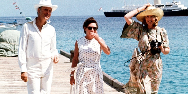 Princess Margaret, center, with Lord Colin Tennant and Lady Anne Glenconner in the West Indies. The royal yacht Britannia is in the background.