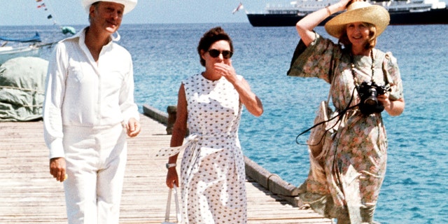 Princess Margaret, center, with Lord Colin Tennant and Lady Anne Glenconner in the West Indies. The royal yacht Britannia is in the background.