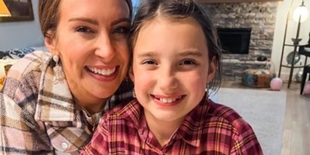 Ginny Lauren Dowden, shown here with her daughter, Roslyn, fought for her little girl to remain mask-free despite school mask mandates in their town in Fayetteville, Arkansas.
