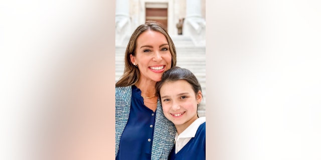 Ginny Lauren Dowden, shown with daughter Rosalyn, has spoken up at school board meetings and at state Senate committee meetings in defense of parental choice and freedoms.