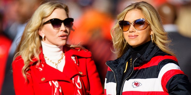 Gracie Hunt, right, the daughter of Kansas City Chiefs owner Clark Hunt, and Tavia Hunt enjoy the sidelines before a game against the Denver Broncos at Empower Field at Mile High on December 11, 2022 in Denver.