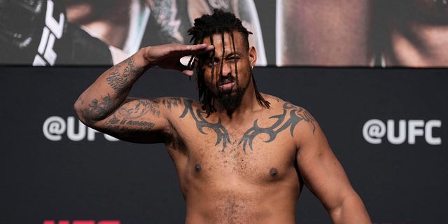 Greg Hardy poses on the scale during the official weigh-in for UFC 272 at UFC APEX on March 4, 2022 in Las Vegas, Nevada.