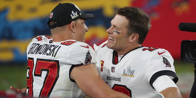 Buccaneers quarterback Tom Brady and tight end Rob Gronkowski celebrate after winning Super Bowl LV against the Kansas City Chiefs on February 7, 2021, at Raymond James Stadium in Tampa, Florida.