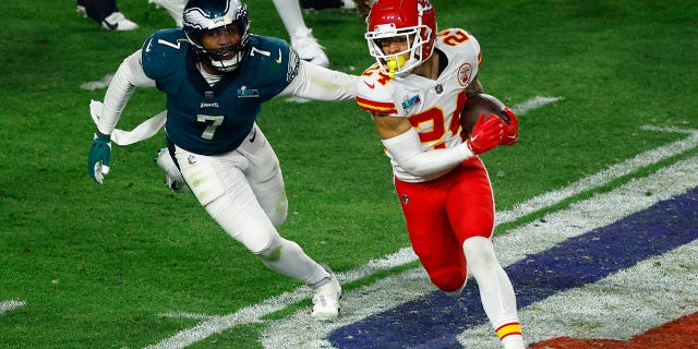 Skyy Moore of the Kansas City Chiefs runs against Haason Reddick of the Philadelphia Eagles during Super Bowl LVII on February 12, 2023.