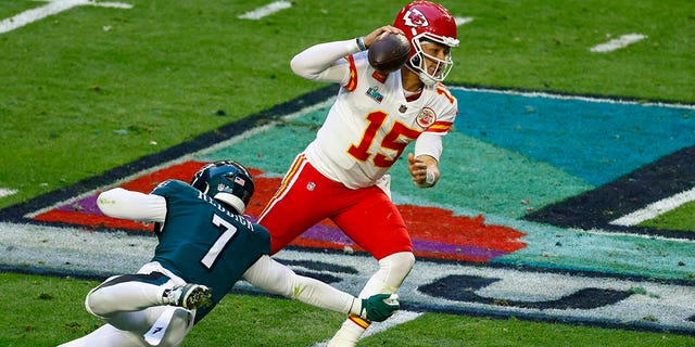 Haason Reddick of the Philadelphia Eagles attempts to tackle Patrick Mahomes of the Kansas City Chiefs in Super Bowl LVII at State Farm Stadium on Feb. 12, 2023, in Glendale, Arizona.