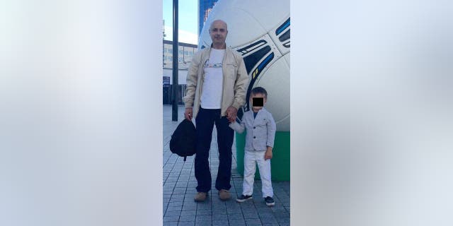 Halyna Hutchins' father, Anatolii Androsovych, with her son, Andros.