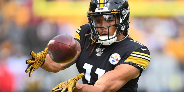 Pittsburgh Steelers number 11 Chase Claypool catches a pass during warmups before a game against the Tampa Bay Buccaneers at Acrisure Stadium on October 16, 2022 in Pittsburgh.