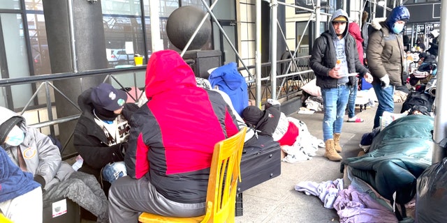 Migrants refuse to relocate from a New York City luxury hotel to a new shelter at the Brooklyn Cruise Terminal.