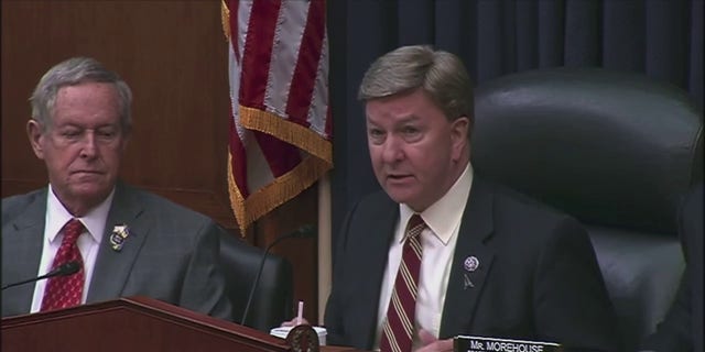 House Armed Services Committee Chairman Mike Rogers, right, delivers an opening statement Tuesday during a hearing on national security threats from China.
