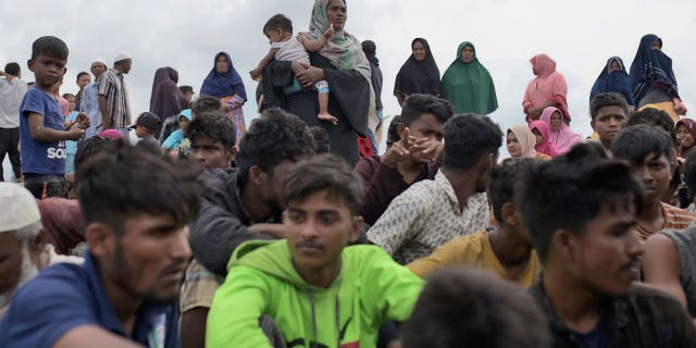 Ethnic Rohingya people rest on Lampanah Leungah beach after disembarking in Aceh Besar, Aceh province, Indonesia on February 16, 2023.