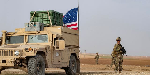 US forces patrol in the vicinity of the Hori rehabilitation center for children of suspected Islamic State (IS) group, in the town of Tel Maaruf in Syria's northeastern Hasakeh province, on December 15, 2022.