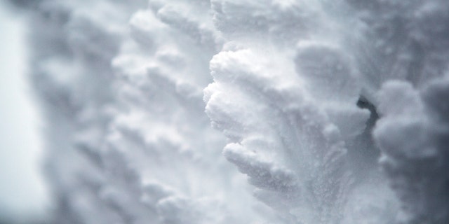 Rime ice grows on the side of the Mount Washington Observatory at the summit of Mount Washington. 