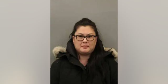 Lai Ying T. Escobedo, 44, a teacher, is accused of hitting children and "pulling their ears."
