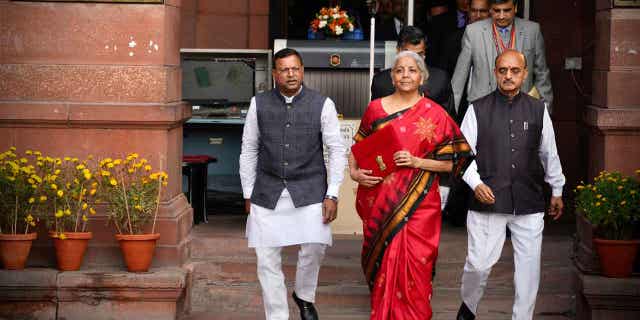 Indian Finance Minister Nirmala Sitharaman, center, leaves her office to give a speech in New Delhi, India, on Feb. 1, 2023.