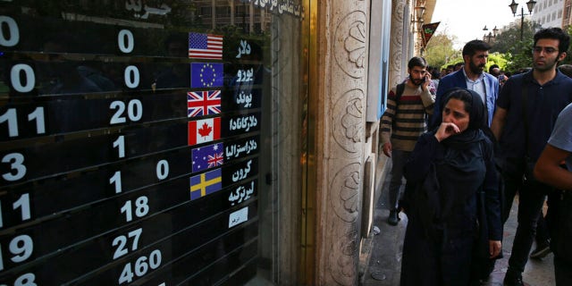 FILE: An exchange shop displays rates for various currencies, in downtown Tehran, Iran, Tuesday, Oct. 2, 2018.
