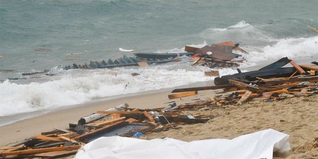 Debris and other wreckage from a migrant boat seen at a beach near Cutro, southern Italy, Sunday, Feb. 26, 2023. 