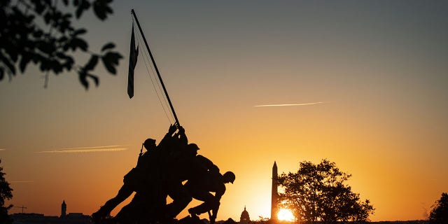 The U.S. Marine Corp Iwo Jima Memorial in front of the U.S. Capitol, center, and Washington Monument, right, in Arlington, Virginia, on Sept. 27, 2021. 