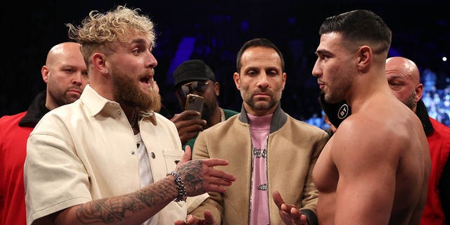 Jake Paul (L) and Tommy Fury (R) face-off prior to Artur Beterbiev vs Anthony Yarde fight night at the OVO Arena Wembley on January 28, 2023 in London, England.