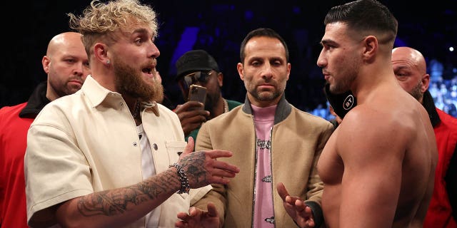 Jake Paul (L) and Tommy Fury (R) face off prior to the Artur Beterbiev vs Anthony Yarde fight night at OVO Arena Wembley on January 28, 2023 in London, England.