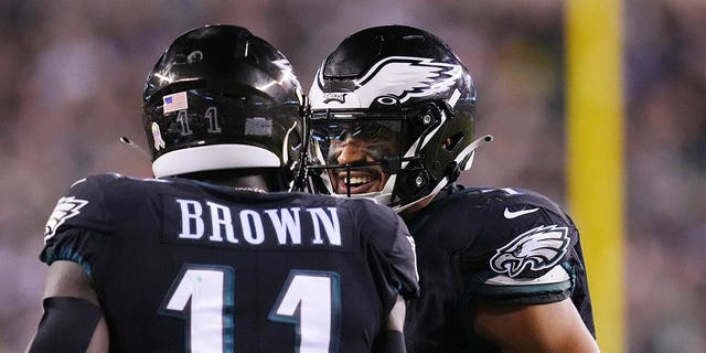 A.J. Brown #11 of the Philadelphia Eagles celebrates with Jalen Hurts #1 after a 6-yard touchdown pass during the third quarter against the Green Bay Packers at Lincoln Financial Field on Nov. 27, 2022 in Philadelphia, Pennsylvania.