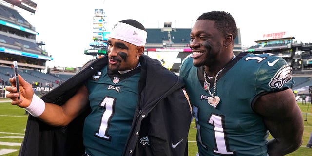 Jalen Hurts #1 and AJ Brown #11 of the Philadelphia Eagles celebrate after defeating the Tennessee Titans at Lincoln Financial Field on December 4, 2022 in Philadelphia, Pennsylvania.