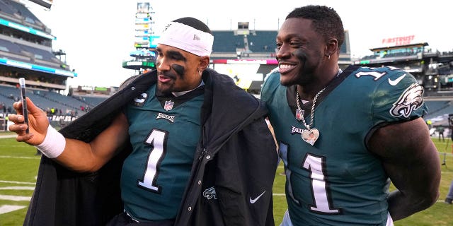 Jalen Hurts #1 and A.J. Brown #11 of the Philadelphia Eagles celebrate after defeating the Tennessee Titans at Lincoln Financial Field on Dec. 4, 2022 in Philadelphia, Pennsylvania.