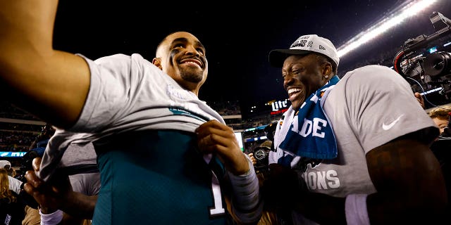 Jalen Hurts #1 and A.J. Brown #11 of the Philadelphia Eagles smile on the field after the Philadelphia Eagles beat the San Francisco 49ers in the NFC Championship NFL football game at Lincoln Financial Field on Jan. 29, 2023 in Philadelphia, Pennsylvania.