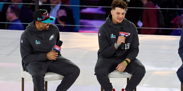 Jalen Hurts #1 of the Philadelphia Eagles speaks with Patrick Mahomes #15 of the Kansas City Chiefs at Footprint Center on February 6, 2023 in Phoenix, Arizona.