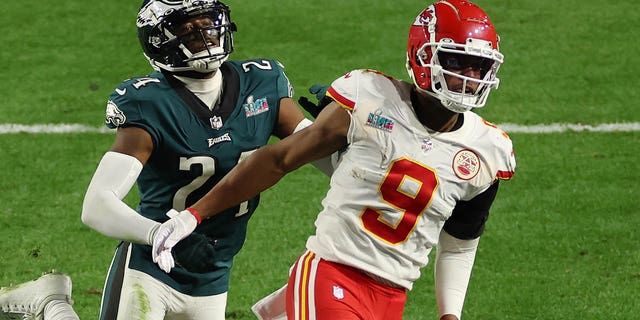 James Bradberry #24 of the Philadelphia Eagles is called for holding against JuJu Smith-Schuster #9 of the Kansas City Chiefs during the fourth quarter of Super Bowl LVII at State Farm Stadium on February 12, 2023 in Glendale, Arizona.