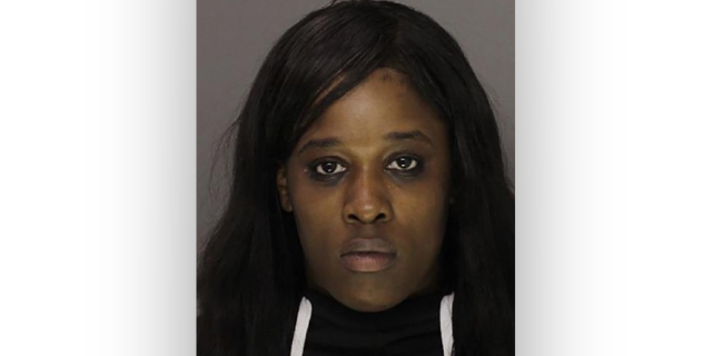 Jasmin Devlin was arrested and charged after her son took a gun from her dresser to school, according to the Montgomery County, Pennsylvania district attorney.