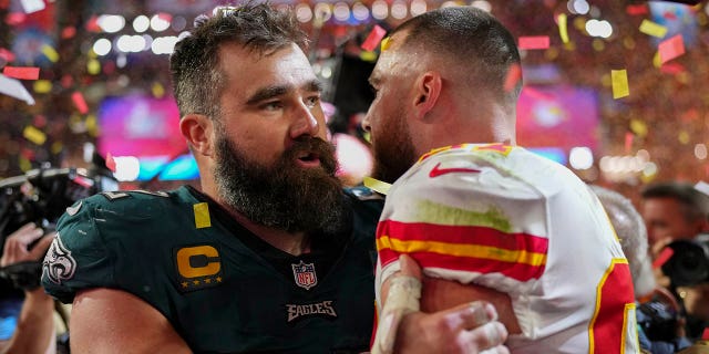 Jason Kelce #62 of the Philadelphia Eagles talks with Travis Kelce #87 of the Kansas City Chiefs after Super Bowl LVII at State Farm Stadium on February 12, 2023 in Glendale, Arizona.  The Chiefs defeated the Eagles 38-35. 