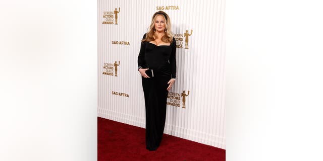 "The White Lotus" star Jennifer Coolidge looked stunning in a tight black dress with long sleeves