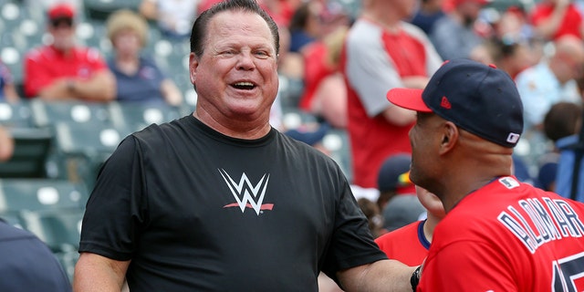 Jerry The King Lawler talks to Cleveland Indians first base coach Sandy Alomar Jr. (15) prior to the the Major League Baseball game between the Kansas City Royals and Cleveland Indians on July 19, 2019, at Progressive Field in Cleveland, OH.