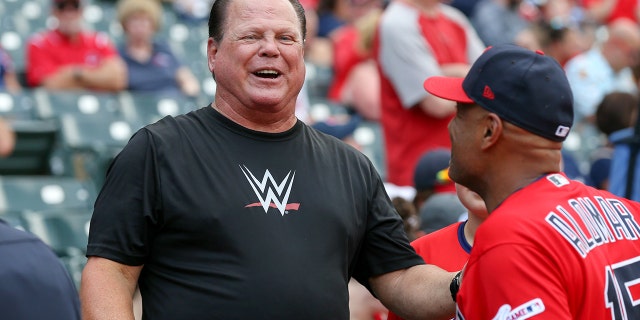 Jerry The King Lawler talks to Cleveland Indians first base coach Sandy Alomar Jr. (15) prior to the the Major League Baseball game between the Kansas City Royals and Cleveland Indians on July 19, 2019, at Progressive Field in Cleveland, OH.