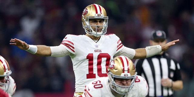  Jimmy Garoppolo #10 of the San Francisco 49ers calls a play during the first half of a game against the Arizona Cardinals at Estadio Azteca on November 21, 2022 in Mexico City, Mexico.