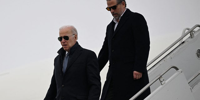 President Biden, with son Hunter Biden, arrives at Hancock Field Air National Guard Base in Syracuse, New York, on Feb. 4, 2023. Biden spoke briefly with reporters about the Chinese spy balloon and said, "we're gonna take care of it." 