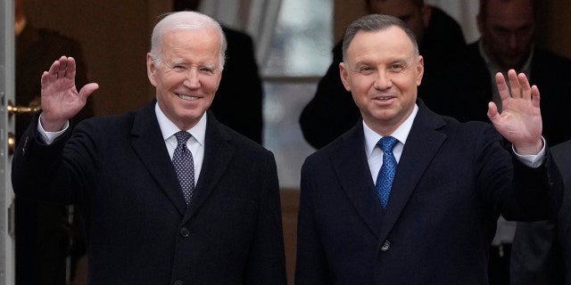 Polish President Andrzej Duda, right, welcomes President Biden at the Presidential Palace in Warsaw, Ukraine, Tuesday, Feb. 21, 2023.