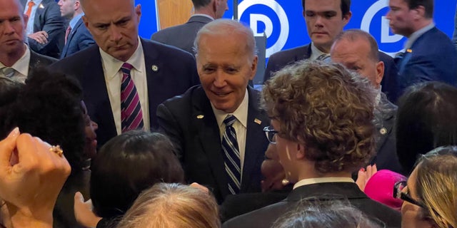 President Biden shakes hands of supporters along the rope line, after addressing the crowd at the Democratic National Committee's winter meeting, in Philadelphia, Pennsylvania, on Feb. 3, 2023