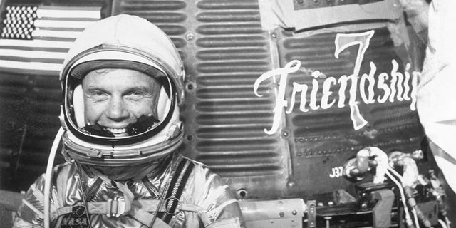 (Original Caption) Cape Canaveral, Florida: Astronaut John H. Glenn Jr. in spacesuit beside Mercury-Atlas 6 spacecraft "Friendship 7."