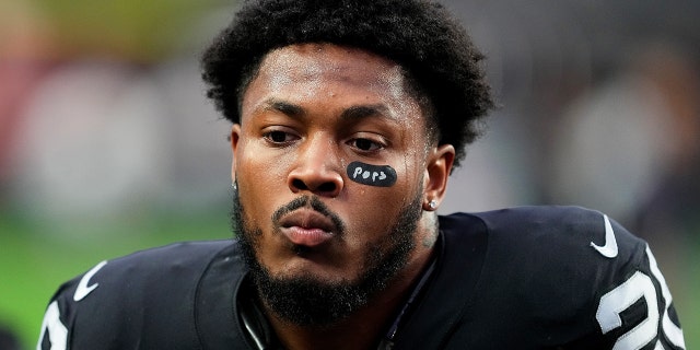 Josh Jacobs of the Raiders warms up for the Kansas City Chiefs game at Allegiant Stadium on January 7, 2023 in Las Vegas.