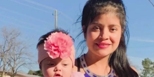 Juana Jose, 22, poses with her daughter. Jose was strangled to death last month and a suspect is on the run, police said this week.