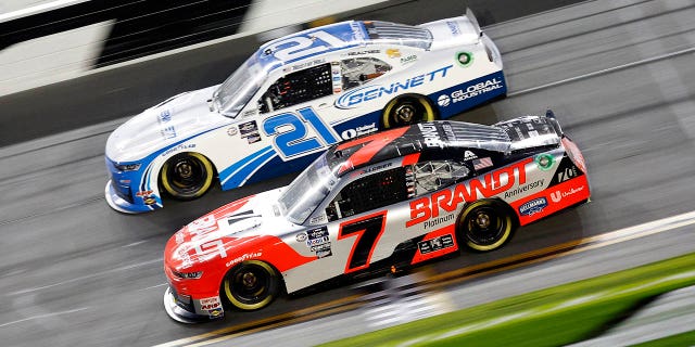 Justin Allgaier, driver of the #7 Brandt Chevrolet, and Austin Hill, driver of the #21 Bennett Transportation Chevrolet, compete during the NASCAR Xfinity Series Beef.  It's what's for dinner.  300 on February 18, 2023 at Daytona Beach.