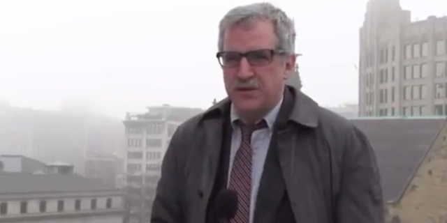 Kevin Killeen of St Louis’ KMOX stands atop a parking garage opining about why February is the worst month of the year.