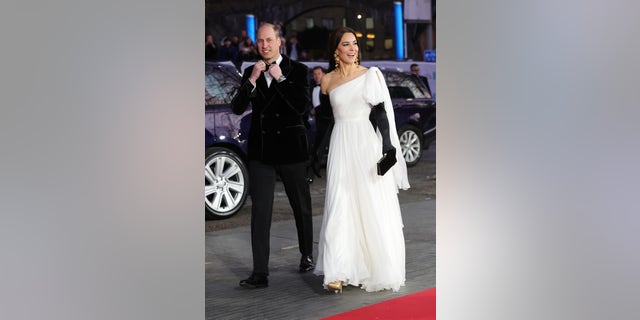 Kate Middleton paired her Alexander McQueen gown with long black opera gloves.
