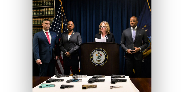 Queens District Attorney Melinda Katz, center, announced a 28-count indictment of 23 alleged members of the Crips gang.