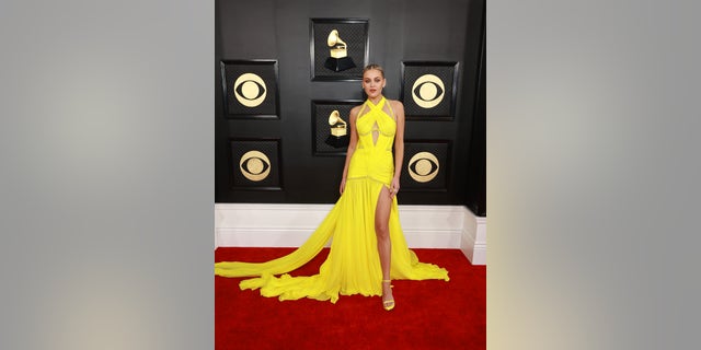 Kelsea Ballerini rocked a bold neon yellow dress with thigh-high cut outs.