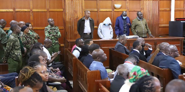 Kenya Police officers at the quay from left to right sentenced Peter Ngugi Kamau, 20, Sylvia Wanjiku Wanjohi, 24, Stephen Cheburet Morogo, 30 and Fredrick Leliman, sentenced to life in Kenya's Milimani court on 3 February 2023.